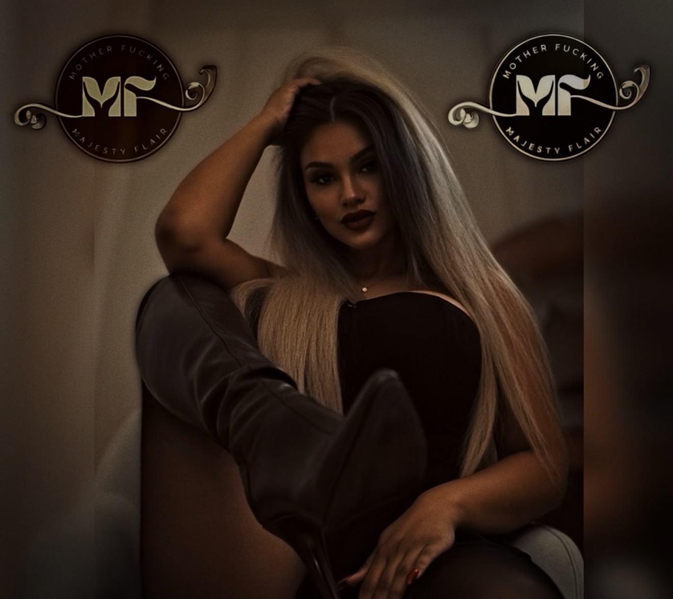 Majesty Flair seated in black with heeled boots